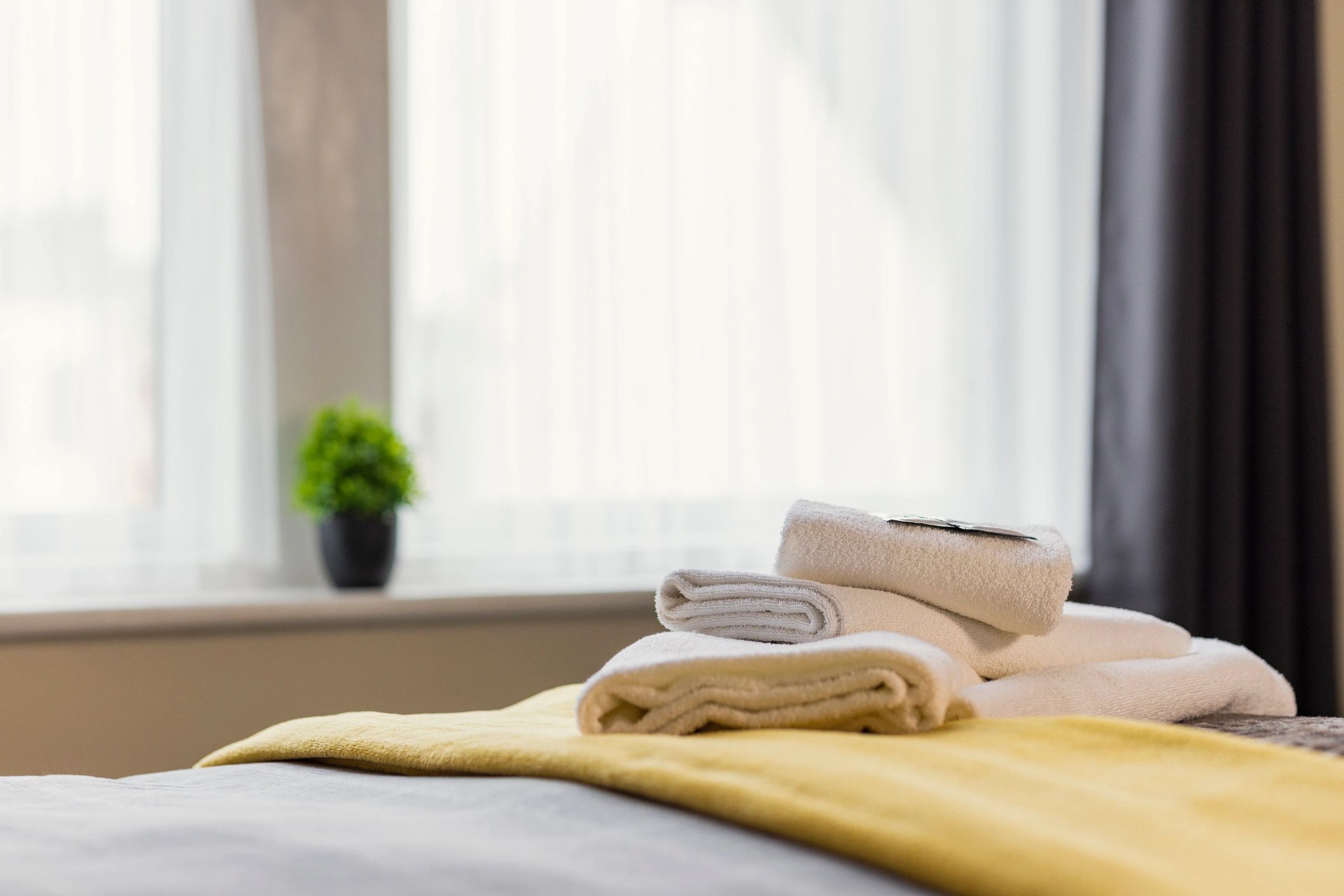 Neatly folded towels prepared for guest arrival