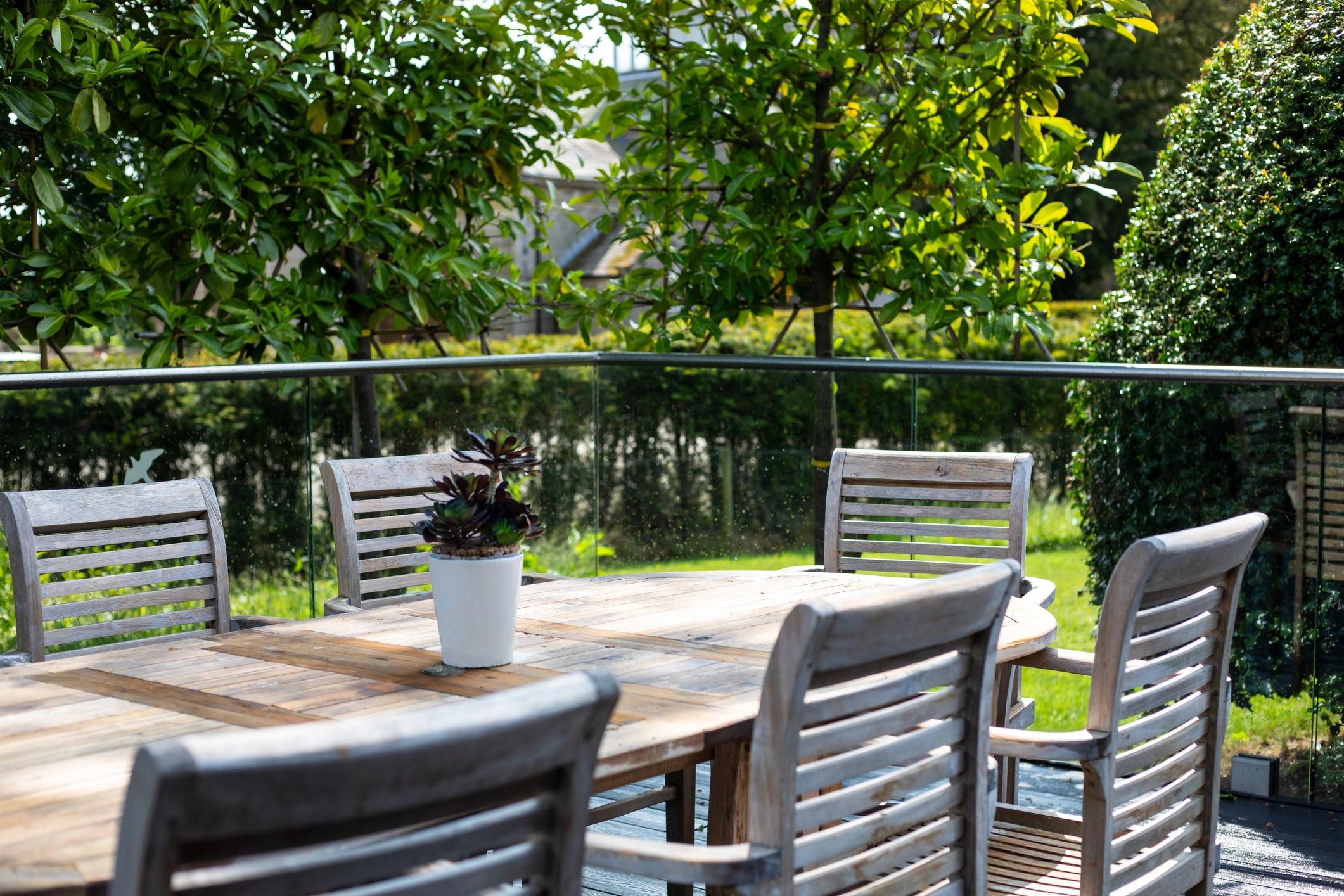 Outdoor patio seating area in a garden setting