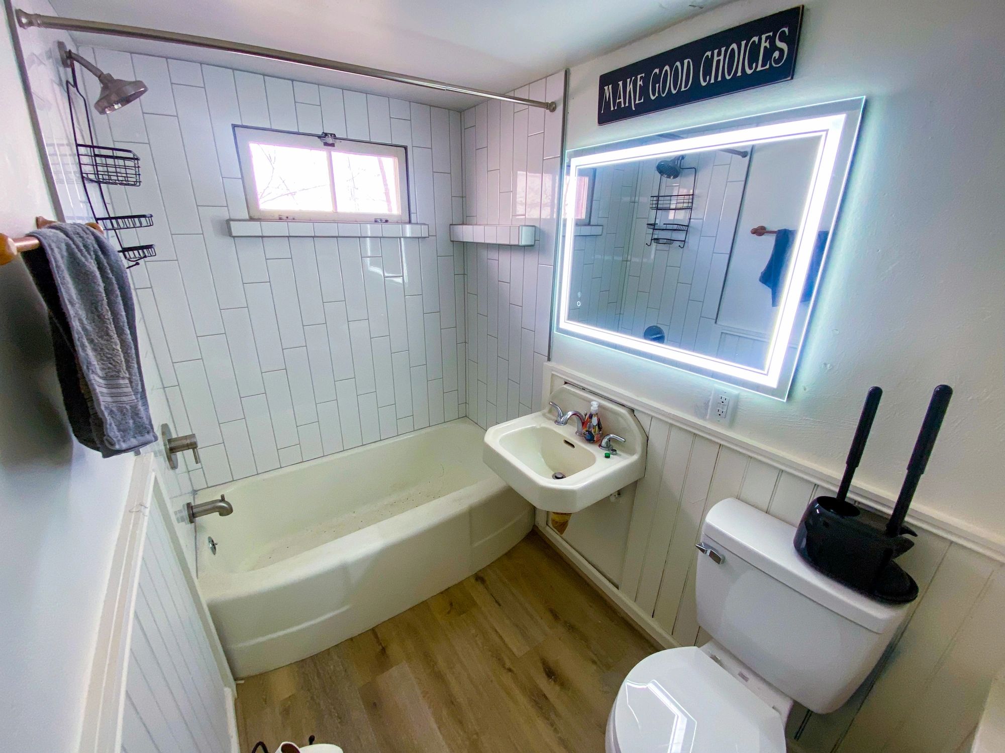 Clean bathroom with tub and shower